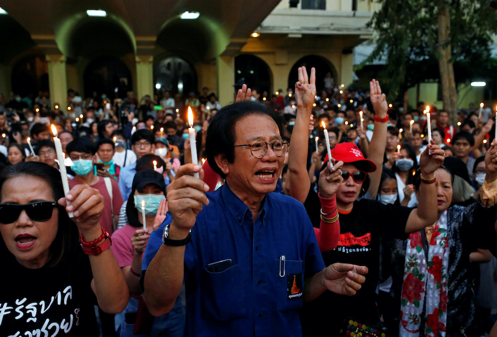 Thai students and supporters hold candles during a protest against a courtu00e2u20acu2122s decision that dissolved the countryu00e2u20acu2122s second largest opposition Future Forward party at Thammasat University in Bangkok, Thailand February 22, 2020. u00e2u20acu201d Reuters picnnn