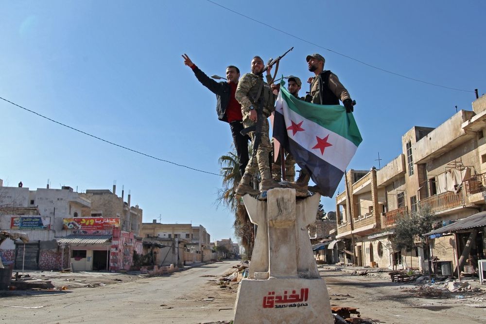 Turkey-backed Syrian fighters celebrate in the town of Saraqib in the eastern part of the Idlib province in north-western Syria, on February 27, 2020. u00e2u20acu201d AFP pic