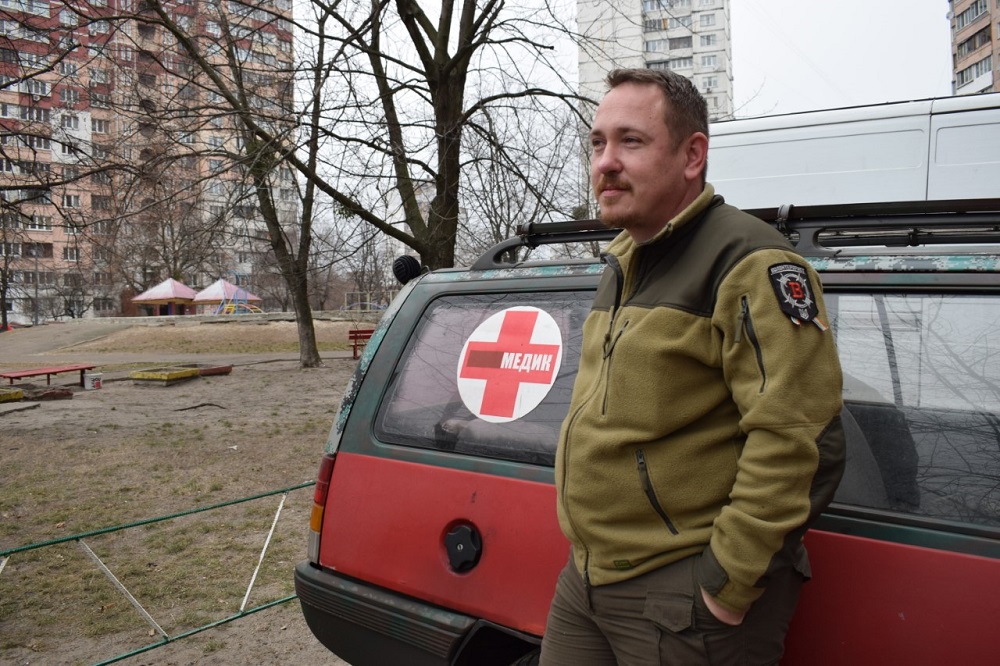 Volunteer military paramedic Nick Buderatsky poses for a photo, with a rainbow ribbon attached to his chevron, in Kiev, Ukraine December 14, 2019. u00e2u20acu201d Thomson Reuters Foundation pic