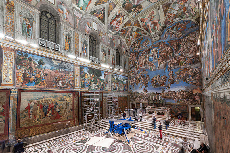 A tapestry designed by Renaissance artist Raphael is installed on a lower wall of the Sistine Chapel at the Vatican as part of celebrations marking the 500th anniversary of his death in this handout photo released February 17, 2020. 