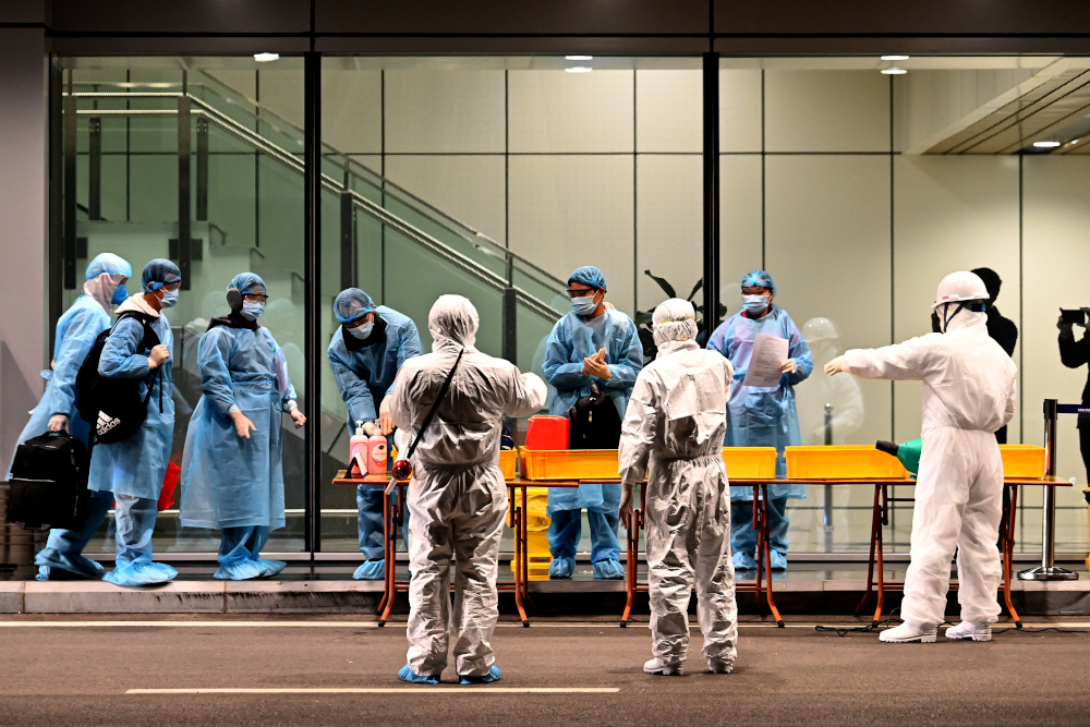 Vietnamese people repatriated from Chinese city of Wuhan wearing protective suits arrive at Van Don airport, Quang Ninh province, Vietnam February 10, 2020. u00e2u20acu201d Reuters pic