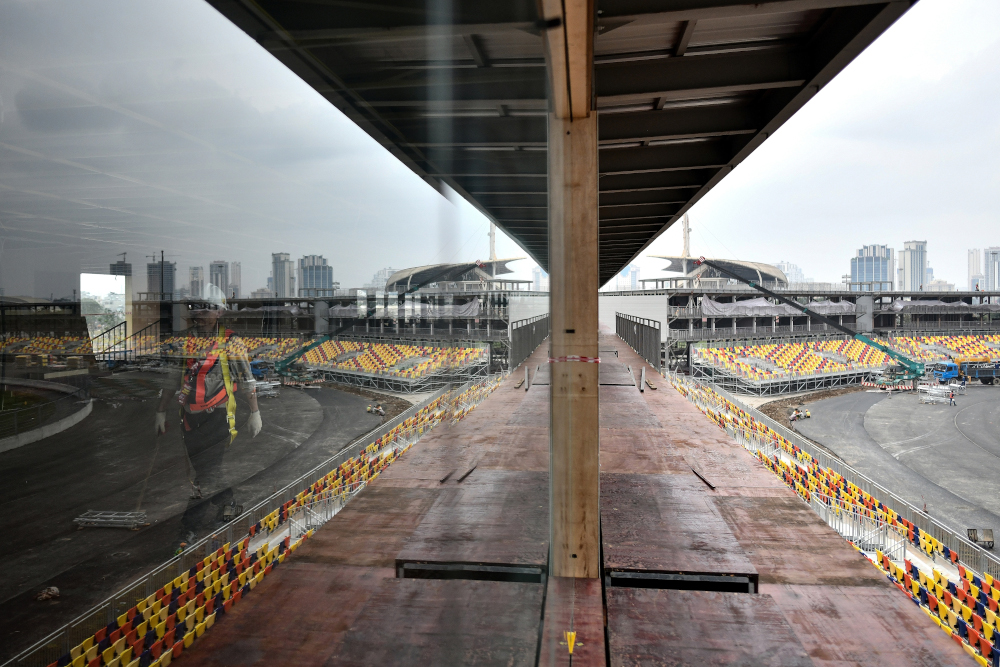 In this file photo taken February 14, 2020, a worker walks past the under-construction Formula One Vietnam Grand Prix race track site in Hanoi, amid concerns of the Covid-19 coronavirus outbreak. u00e2u20acu201d AFP pic