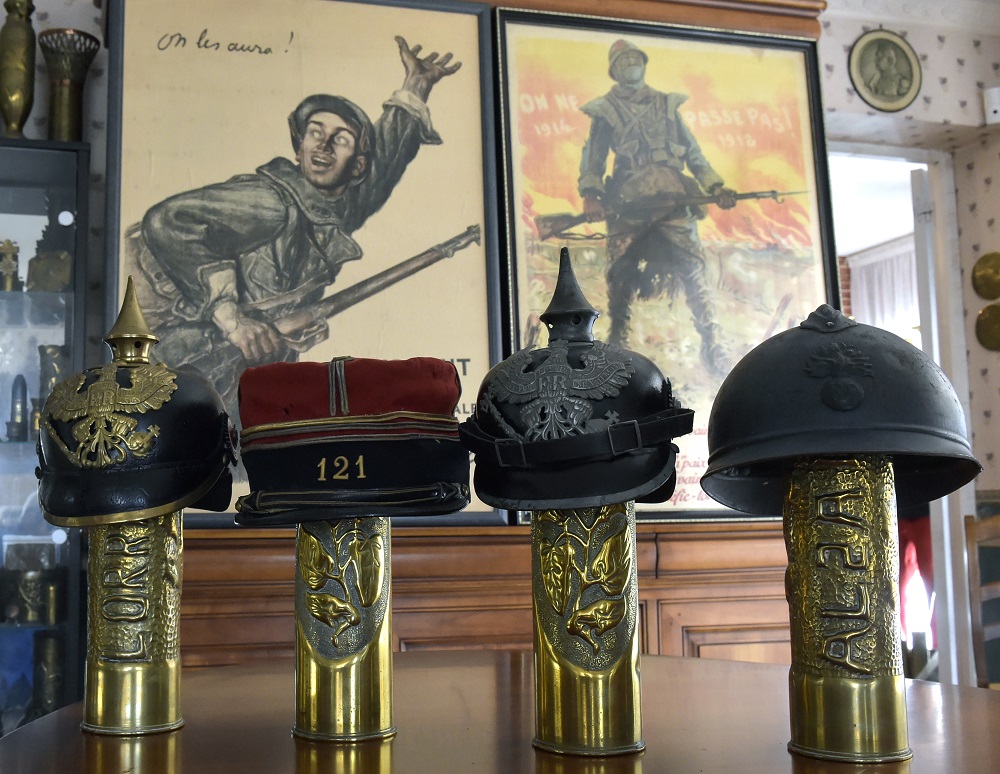 From left: A August 29, 2018 photo displays helmets from WWI: Prussian helmet of 1895, French Kepi of the uniform model 1884, Prussian helmet of 1915 and French helmet Adrian of 1915 u00e2u20acu201d at Serge and Chantal Giudiceu00e2u20acu2122s house in Balma, France. u00e2u20acu201d AFP pic