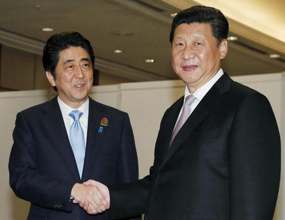 File picture shows Japanu00e2u20acu2122s Prime Minister Shinzo shaking hands with Chinau00e2u20acu2122s President Xi Jinping at the start of their bilateral meeting on the side lines of the Asian-African Conference in Jakarta, April 22, 2015. u00e2u20acu201d Kyodo/Reuters pic