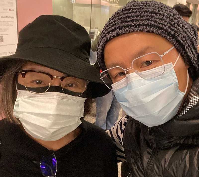 Joe Tay taking a selfie with his godmother Angelina Lo after passing her some face masks. — Photo via Instagram/joelatte