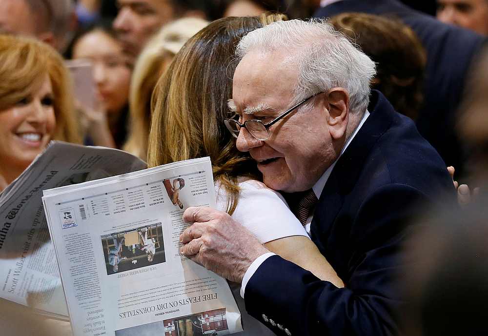 Berkshire Hathaway chairman and CEO Warren Buffett hugs former model Kathy Ireland before the Berkshire Hathaway annual meeting in Omaha, Nebraska May 6, 2017. u00e2u20acu201d Reuters pic 