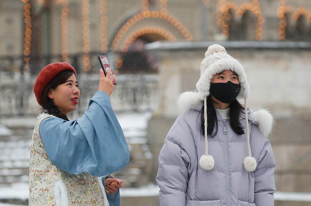 Young Chinese women are pictured wearing mask in the Red Square in Moscow, Russia January 28, 2020. u00e2u20acu201d Reuters pic