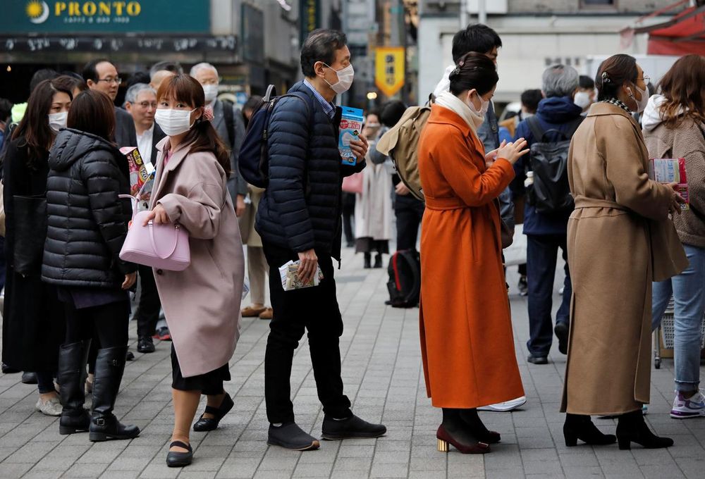 People wearing masks queue to buy masks at a drugstore in Tokyo, Japan February 14, 2020. u00e2u20acu201d Reuters pic
