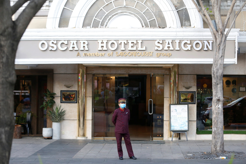 A hotel bell boy wearing a face mask is seen in Ho Chi Minh, Vietnam February 13, 2020. u00e2u20acu201d Reuters pic