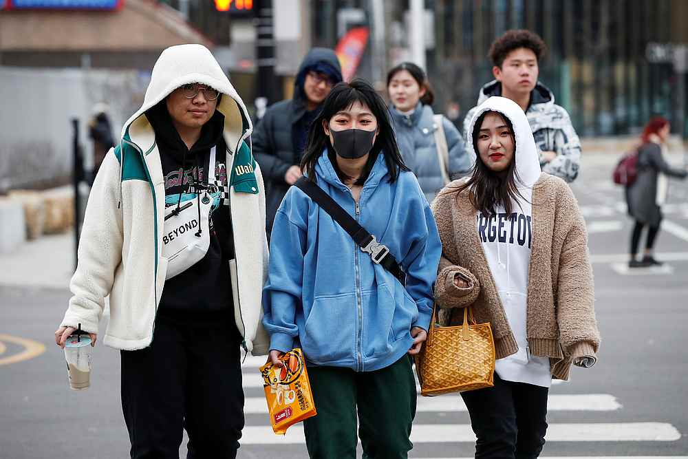 A woman wears a mask in Chinatown following the outbreak of the novel coronavirus, in Chicago, Illinois January 30, 2020. u00e2u20acu201d Reuters pic
