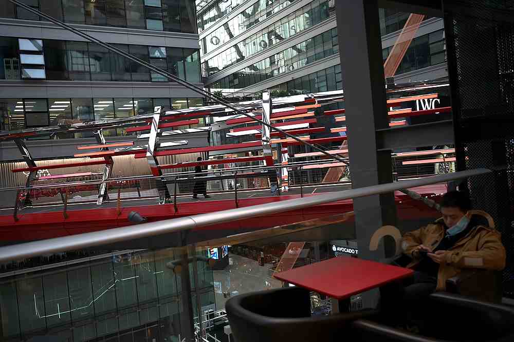 A man with a face mask sits at a cafe inside a shopping mall, following an outbreak of the novel coronavirus, in Beijing, China February 12, 2020. u00e2u20acu201d Reuters pic