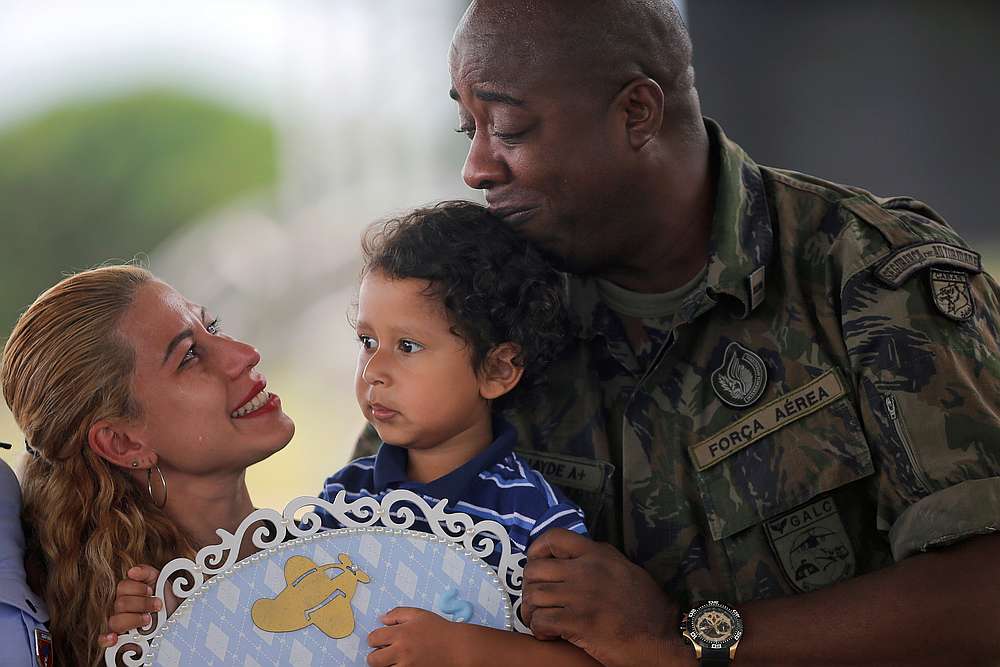 Brazilian citizens who were repatriated from China's coronavirus-struck Wuhan, react with an Air Force soldier at the Air Force base of Anapolis, Goias February 23, 2020. u00e2u20acu201d Reuters pic 