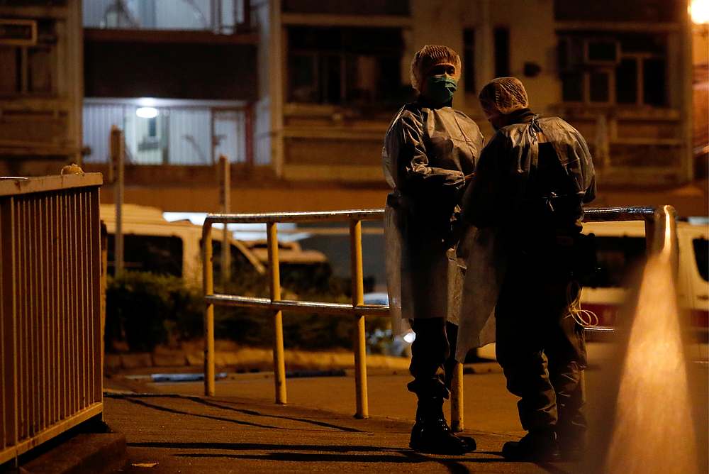 Police in protective gear wait to evacuate residents from a public housing building, following the outbreak of the novel coronavirus, in Hong Kong February 11, 2020. u00e2u20acu201d Reuters pic