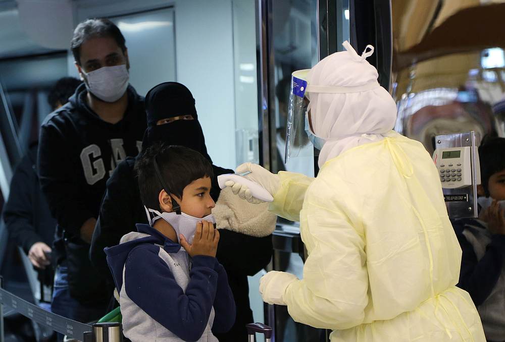 Passengers coming from China wearing masks are checked by Saudi Health Ministry employees upon their arrival at King Khalid International Airport, in Riyadh, Saudi Arabia January 29, 2020. u00e2u20acu201d Reuters pic 
