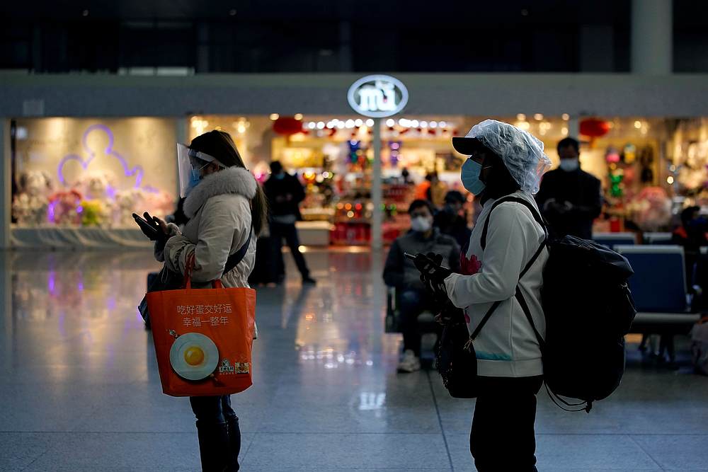 Travellers with face masks and shields are seen at the Shanghai Hongqiao Railway Station on the last day of the Spring Festival travel rush in Shanghai, China February 18, 2020. u00e2u20acu201d Reuters pic