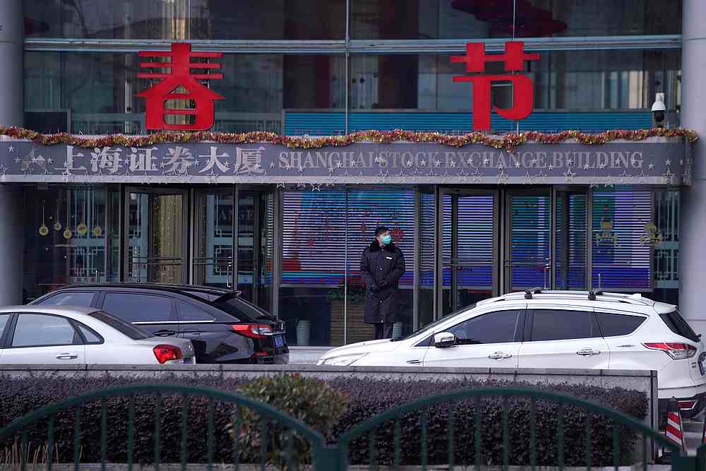 A security guard stands at the Shanghai Stock Exchange building at the Pudong financial district in Shanghai, China,as the country is hit by an outbreak of a new coronavirus February 3, 2020. u00e2u20acu201d Reuters pic 
