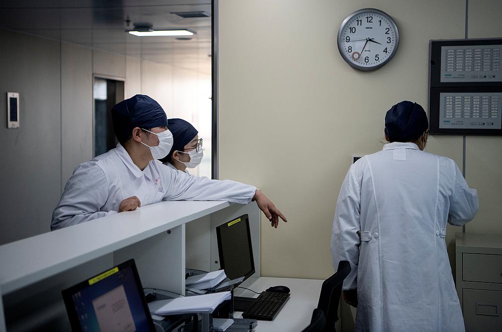 The nurses talk inside building A2 of the Shanghai Public Clinical Centre, following the outbreak of Covid-19, in Shanghai, China February 17, 2020. u00e2u20acu201d Noel Celis/Pool pic via Reuters