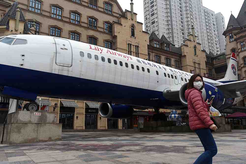 A woman wearing a face mask walks past a restaurant that is built in an aircraft at a shopping complex in Wuhan, the epicentre of the coronavirus outbreak, Hubei province, China February 26, 2020. u00e2u20acu201d Reuters pic