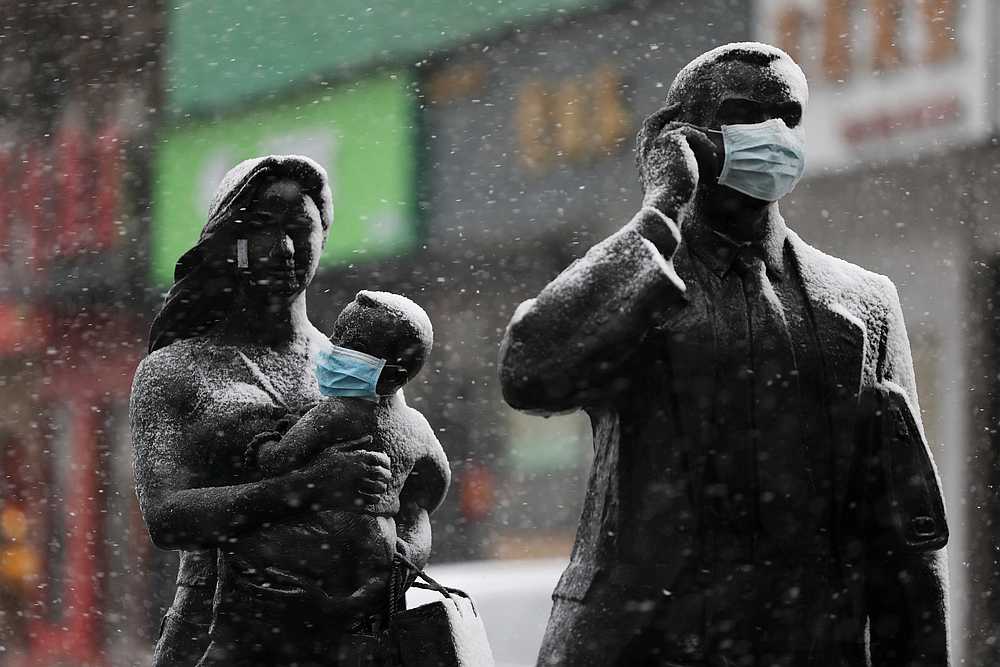 Statues with face masks on are seen amid snow in Wuhan, the epicentre of the Covid-19 outbreak, in Hubei province, China February 15, 2020. u00e2u20acu201d China Daily pic via  Reuters