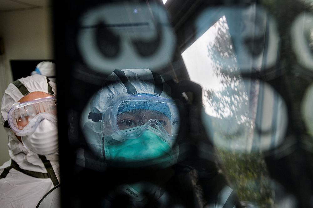 Medical workers check a CT (computed tomography) scan image of a patient at a community health service centre in Wuhan, Hubei province, China February 8, 2020. u00e2u20acu201d China Daily pic via Reuters