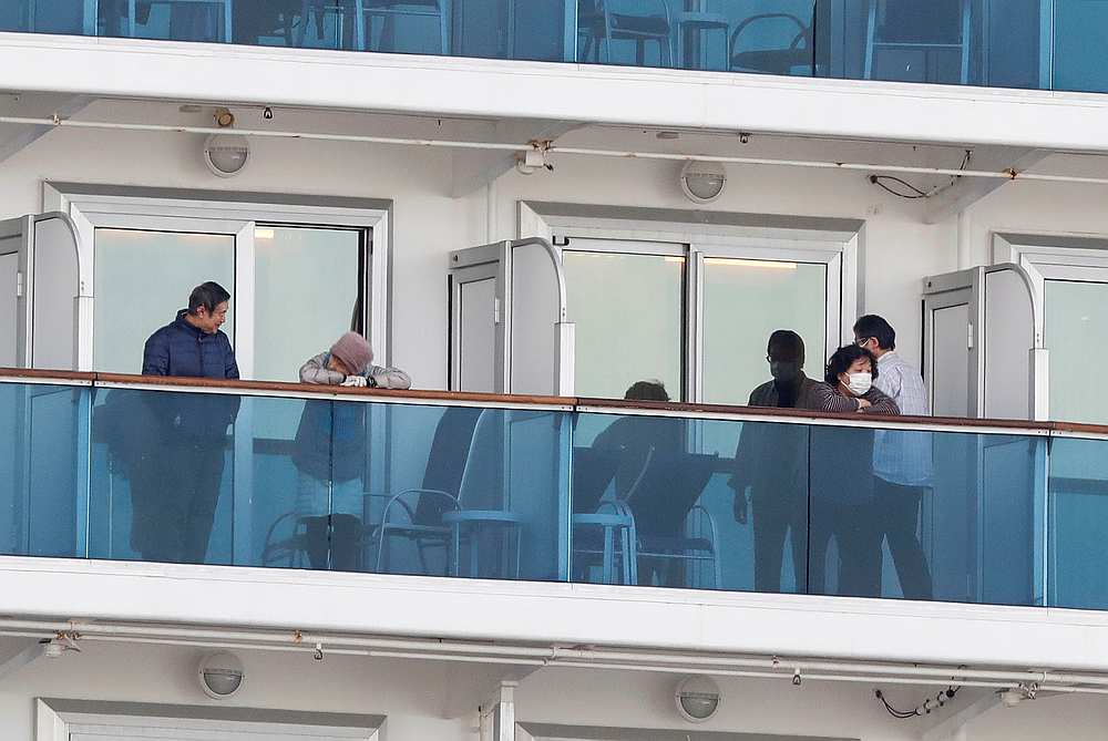Passengers seen in their cabins on the cruise ship Diamond Princess at Daikoku Pier Cruise Terminal in Yokohama, south of Tokyo, Japan February 7, 2020. u00e2u20acu201d Reuters pic