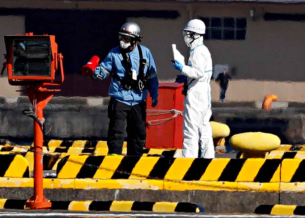 Officers in protective gear at a maritime police's base where people who were transferred from cruise ship Diamond Princess in Yokohama, Japan February 5, 2020. u00e2u20acu201d Reuters pic