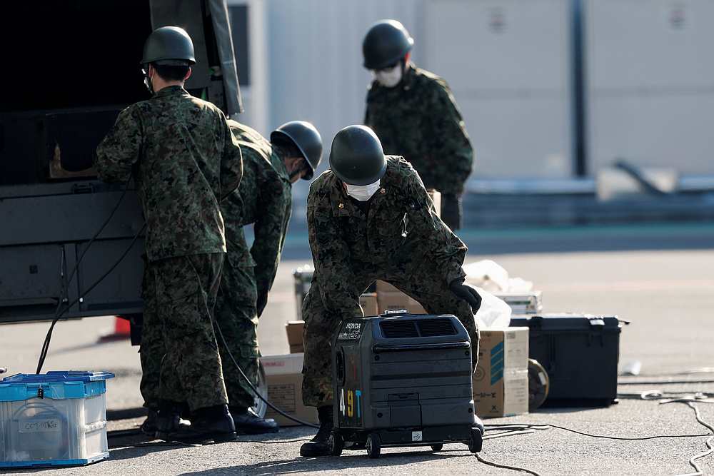 Japan Self-Defence Force (JSDF) soldiers work in front of the cruise ship Diamond Princess in Yokohama, south of Tokyo, Japan February 13, 2020. u00e2u20acu201d Reuters pic