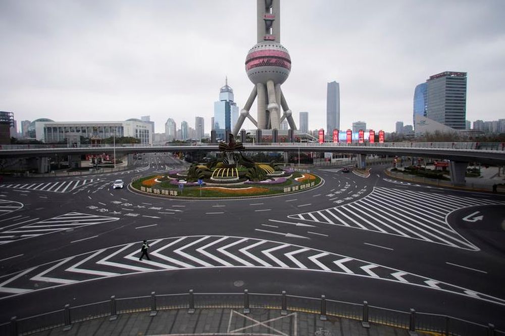 A police officer wears a mask as he walks in front of the Oriental Pearl Tower in Lujiazui financial district in Pudong, Shanghai, China, February 5. u00e2u20acu201d Reuters pic