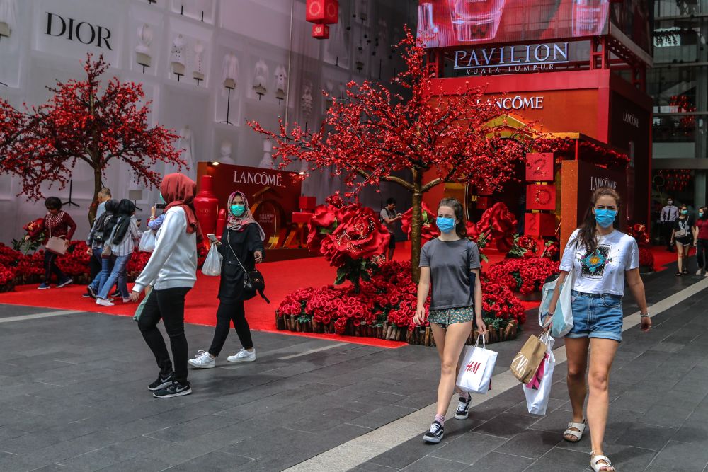 People wearing face masks are pictured outside Pavilion Kuala Lumpur February 10, 2020. u00e2u20acu201d Picture by Firdaus Latif