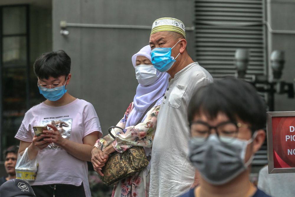 People wearing face masks are pictured outside Pavilion Kuala Lumpur February 10, 2020. u00e2u20acu201d Picture by Firdaus Latif