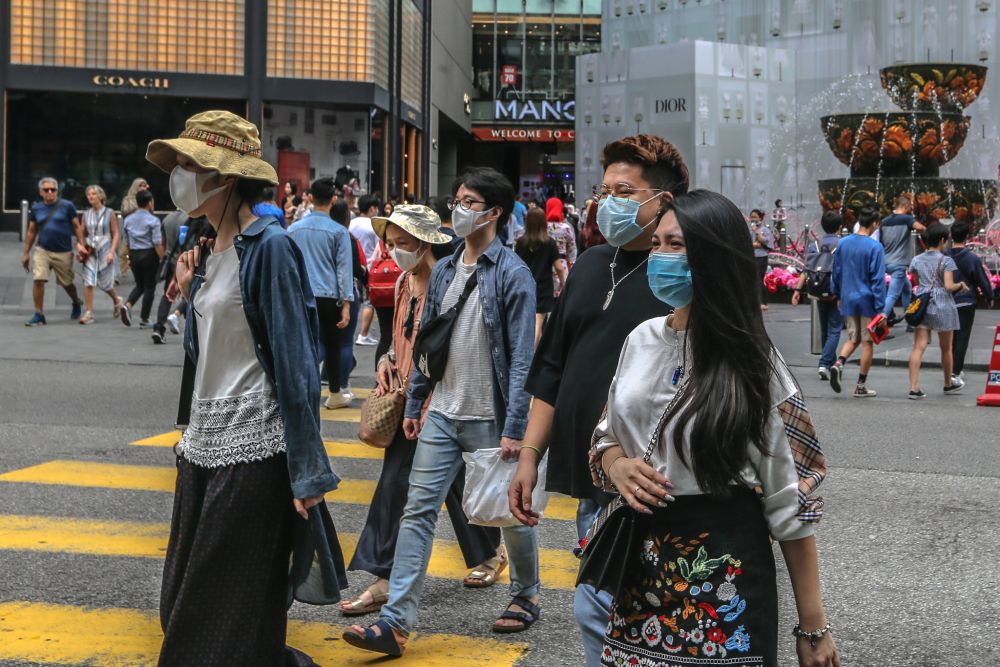 People wearing face masks are pictured outside Pavilion Kuala Lumpur February 10, 2020. u00e2u20acu201d Picture by Firdaus Latif