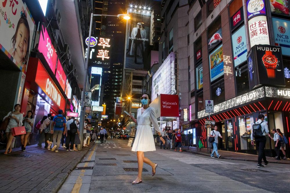 A woman crosses a street in the Central business district in Hong Kong, China August 22, 2019. u00e2u20acu201d Reuters pic
