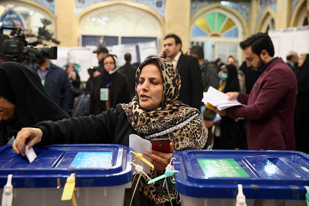 A woman casts her vote during parliamentary elections at a polling station in Tehran, Iran February 21, 2020. u00e2u20acu201d Nazanin Tabatabaee/Wana pic via Reuters