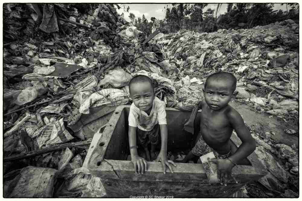 Orang Asli children are seen playing in the landfill. ― Picture by SC Shekar