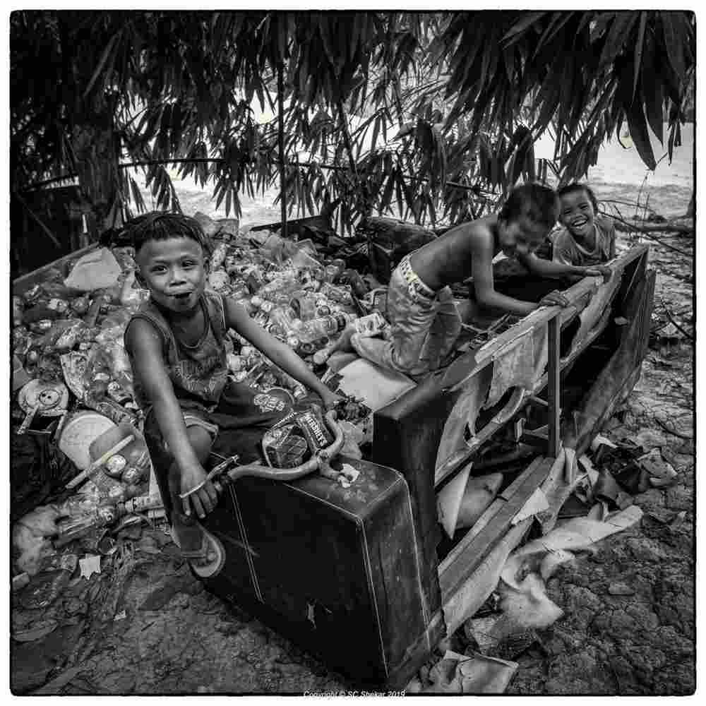 Orang Asli children are seen playing in the landfill. ― Picture by SC Shekar