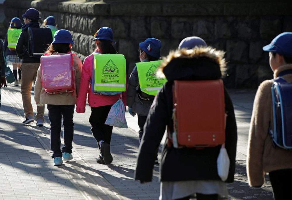 Elementary school students walk toward their school in Tokyo, Japan, February 28, 2020. u00e2u20acu201d Reuters pic