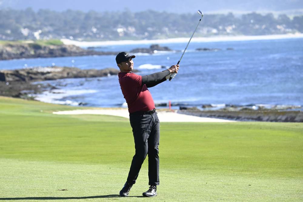 Jason Day hits his fairway shot on the 18th hole during the second round of the AT&T Pebble Beach Pro-Am golf tournament at Pebble Beach Golf Links. u00e2u20acu2022 Michael Madrid-USA TODAY Sports pic via Reuters