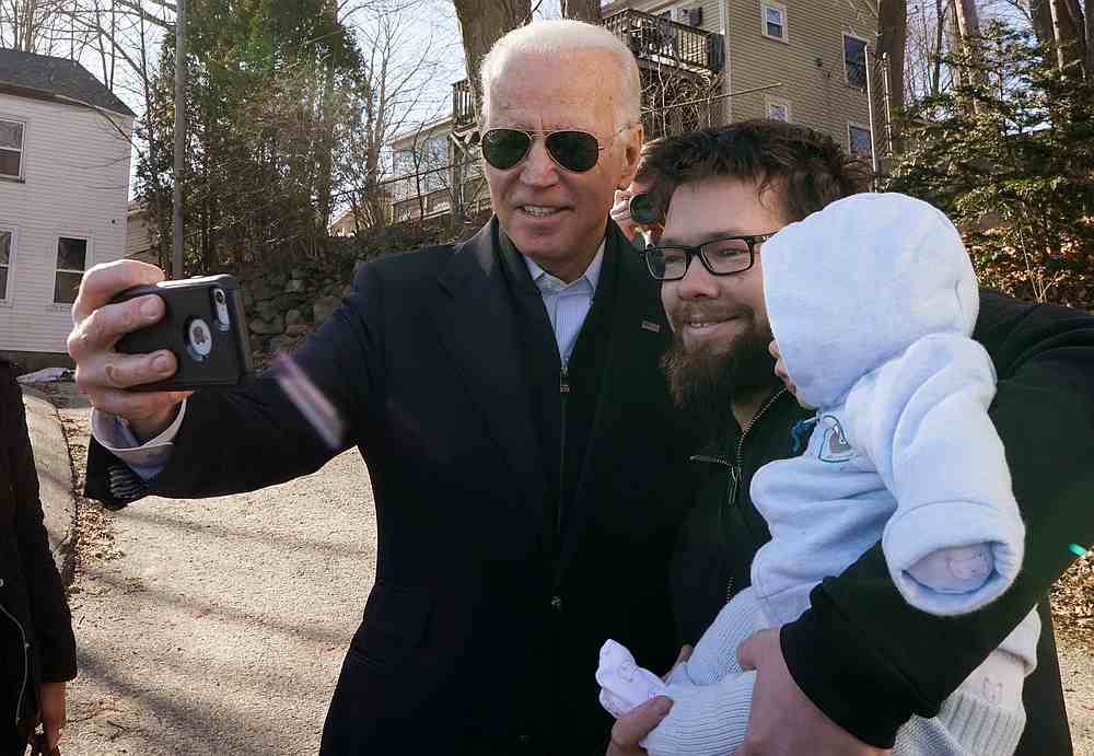 Democratic presidential candidate and former US Vice President Joe Biden greets a man with his baby after a campaign event in Somersworth, New Hampshire February 5, 2020. u00e2u20acu201d Reuters pic