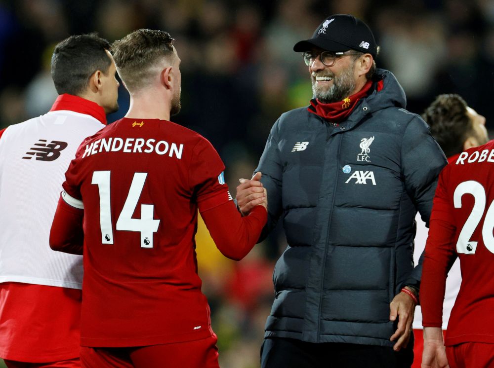 Liverpool manager Jurgen Klopp celebrates with Jordan Henderson after the match against Norwich City at Carrow Road February 15, 2020. u00e2u20acu201d Reuters pic