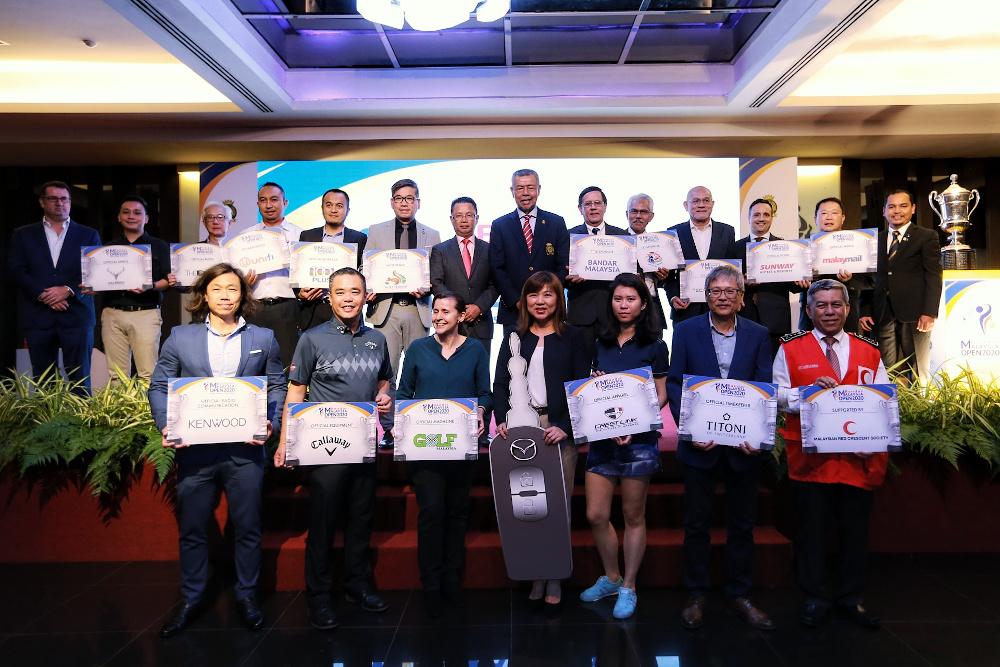 MGA president Admiral Tan Sri Mohd Anwar Mohd Nor takes a group photo with sponsor partners after the ceremony February 19, 2020. — Picture by Ahmad Zamzahuri