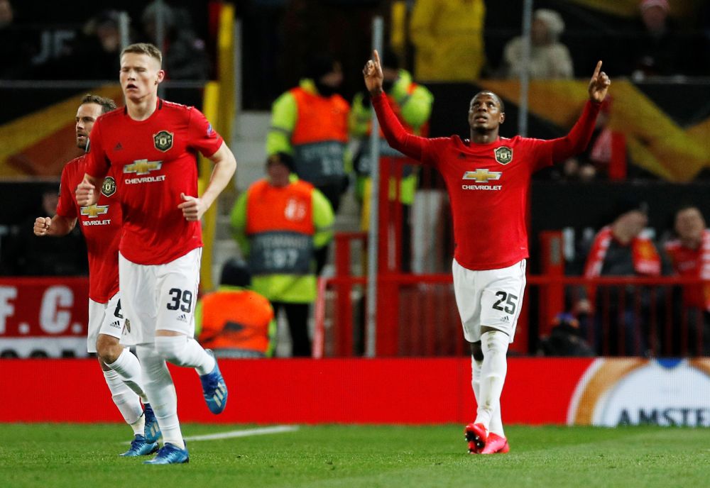 Manchester United's Odion Ighalo (right) celebrates scoring their second goal against Club Brugge. u00e2u20acu201d Reuters pic 