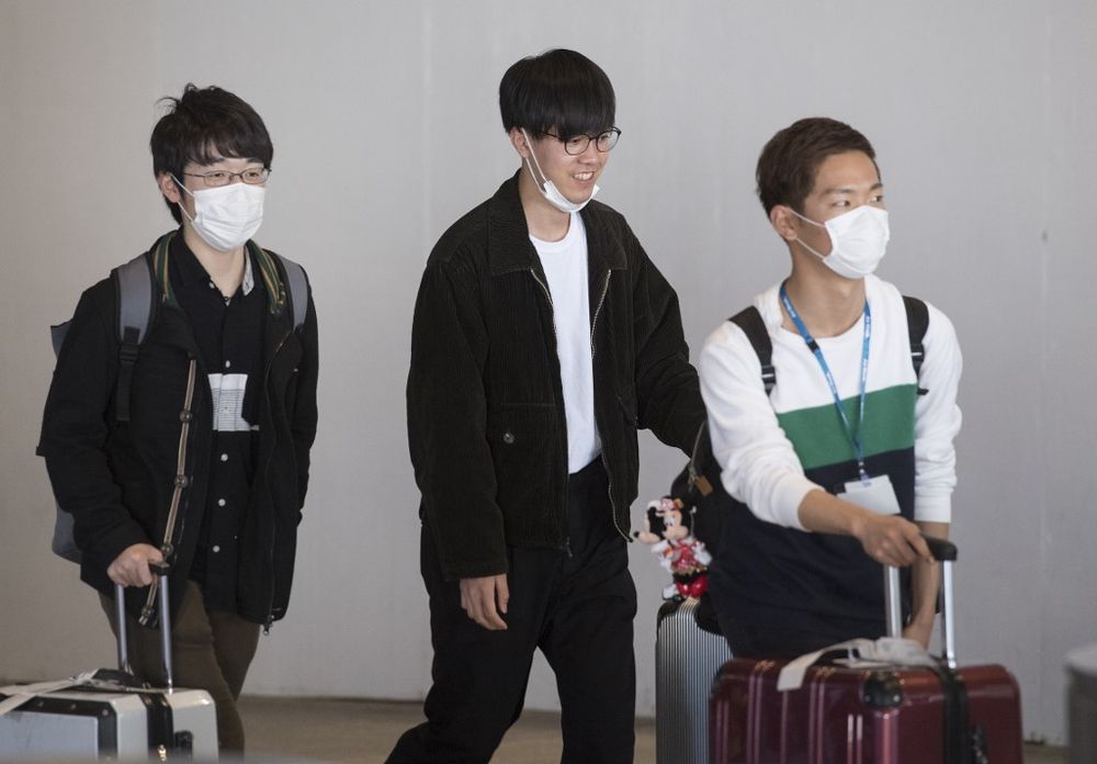 Passengers wear face masks to protect against the spread of the Coronavirus as they arrive on a flight from Asia, at Los Angeles International Airport, California, on February 1, 2020. u00e2u20acu201d AFP pic