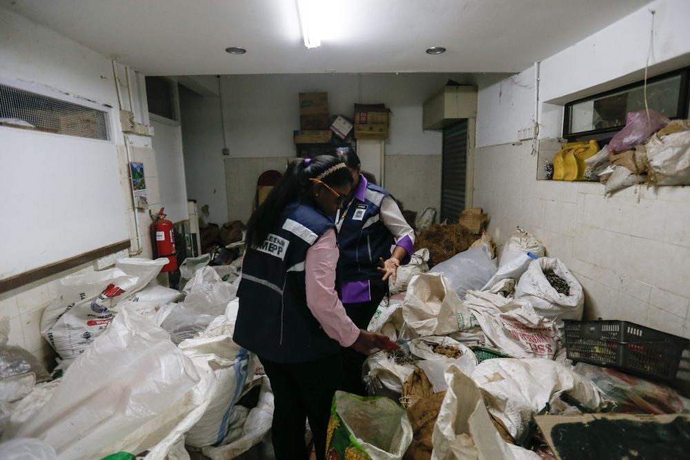Enforcement officers from the Penang Island City Council conduct checks on an eatery in George Town February 26, 2020. u00e2u20acu201d Picture by Sayuti Zainudin