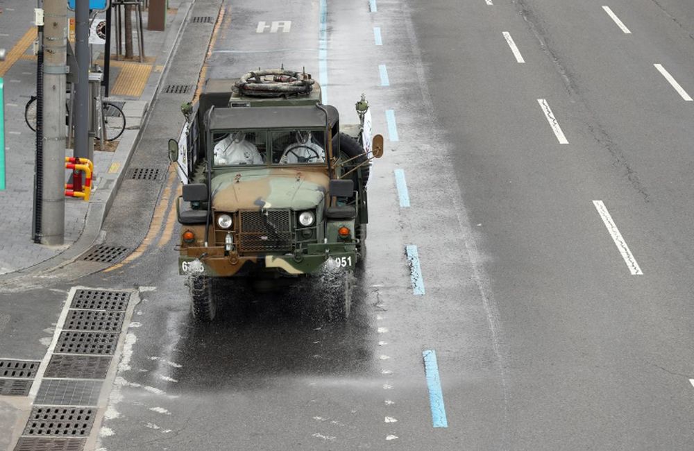 A military vehicle disinfects a street in Daegu, South Korea, February 27, 2020. u00e2u20acu201d Yonhap picture via Reuters