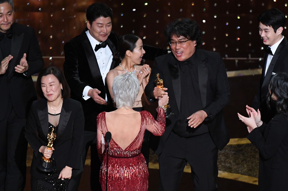 u00e2u20acu02dcParasiteu00e2u20acu2122 producers Kwak Sin-ae (left) and Bong Joon-ho accept the award for Best Picture during the 92nd Oscars at the Dolby Theatre in Hollywood, California February 9, 2020. u00e2u20acu201d AFP pic