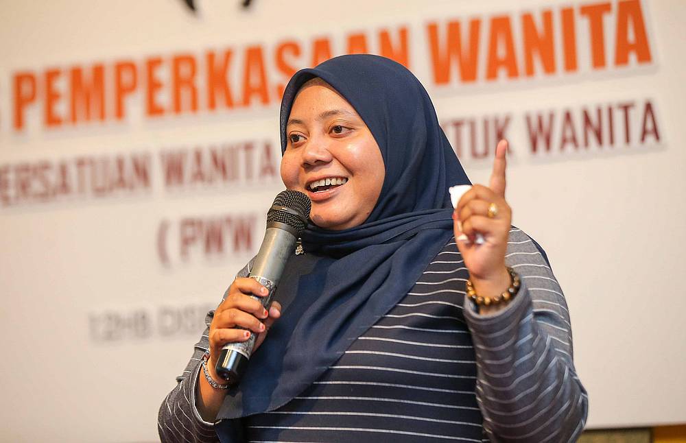 Parking attendant Norazzah Jaafar Halmi says getting scolded by customers is the norm. — Picture by Farhan Najib