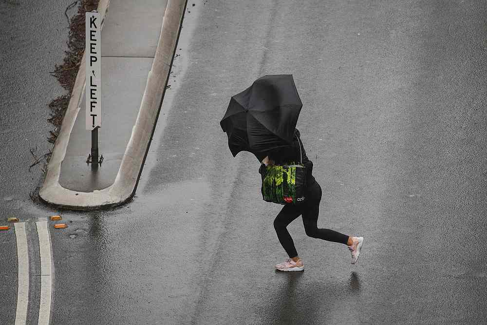 A pedestrian braves strong wind and rain in Sydney, New South Wales, Australia February 9, 2020. u00e2u20acu201d Reuters pic