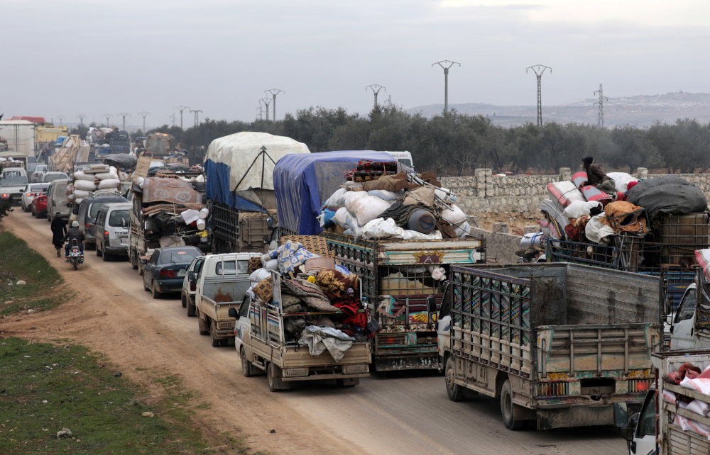 A general view of vehicles carrying belongings of internally displaced Syrians from western Aleppo countryside, in Hazano near Idlib February 11, 2020. u00e2u20acu201d Reuters pic