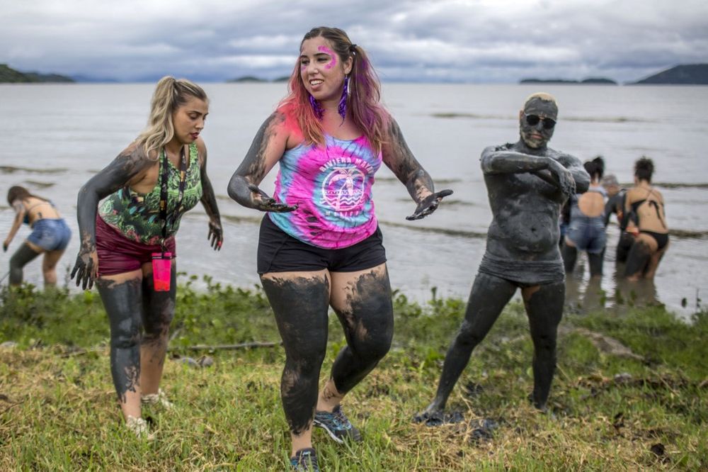 Revellers take part in the u00e2u20acu02dcBloco da Lamau00e2u20acu2122, a mud carnival party, in Paraty, Rio de Janeiro state, Brazil, on February 22, 2020. u00e2u20acu201d AFP pic