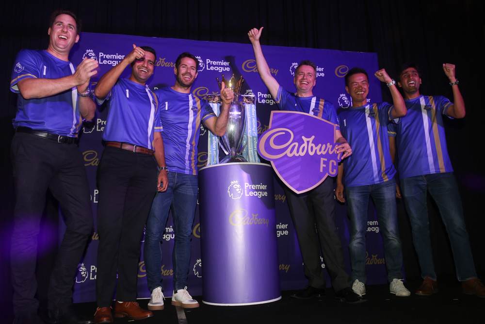 Redknapp and officials from Cadbury and Mondelez International pose with the EPL trophy. — Picture by Choo Choy May